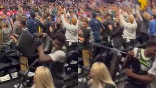 Close up video of Anthony Edwards throwing the chair and hitting two women