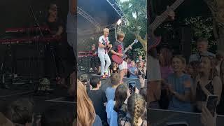 Cant believe this happened  10 year old asks band at festival to let him play guitar..