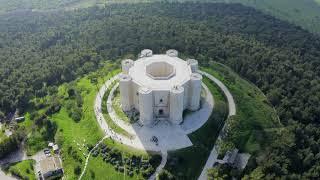 Castel Del Monte in Puglia Italy -  4k drone shot of a medieval castle with octagonal shape.