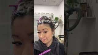 hairstylist helps hairstylist highlight hair