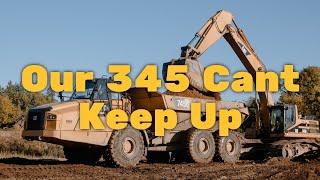 Caterpillar 345 & Caterpillar 336 Excavators loading trucks