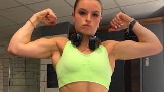 Beautiful muscle girl flexing