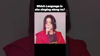 what language is she singing along to?