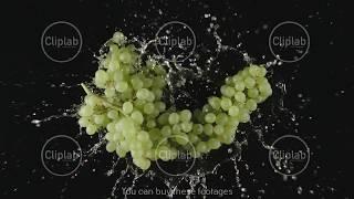 TOP VIEW Bunch of green grapes fallы in a water splashing - Slow motion