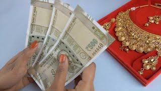 Young female counts a bundle of Indian currency notes - gold l...  Indian Stock Footage  Knot9