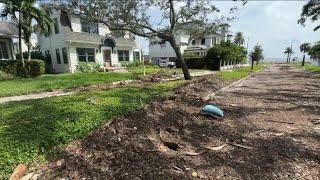 Tampa begins clean up after record storm surge from Helene leaves neighborhoods under water