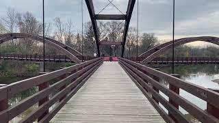 Walking Across The Tridge At Chippewassee Park In Midland Michigan