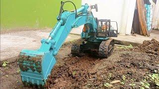 Wltoys rc excavator working. Digging makes it look like a small trench by rc excavator. Part 1.