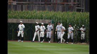 Kevin Costner leads the Yankees and White Sox out of the cornfield at MLB at Field of Dreams