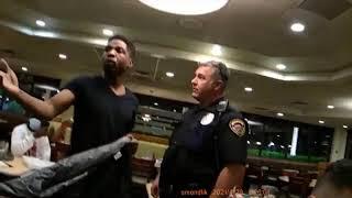 #Policeactivity Sioux city cop push Black Man onto a table Aim to Taser At Him