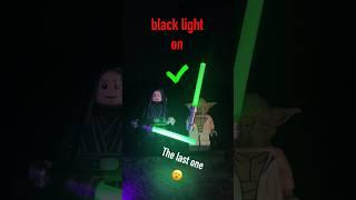 Star Wars minifigures under a black light