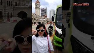 Chinese tourist taking video selfie at Dataran Merdeka targeted by snatch thief video goes viral