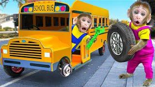 KiKi Monkey pretends to be a fake Car Mechanic fix School Bus Wheel on the road  KUDO ANIMAL KIKI