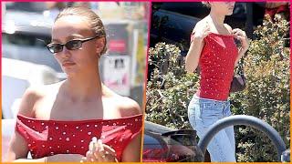 Lily-Rose Depp sizzles in a red off-the-shoulder top and jeans while enjoying a summer outing with