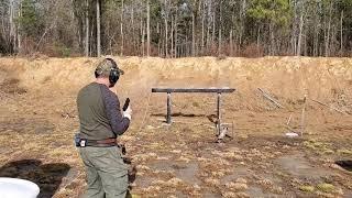 Mark Minervini on the plate rack with his carry pistol