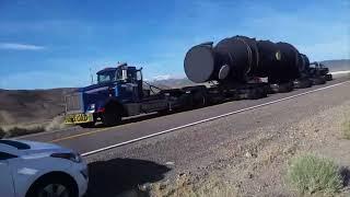 Lady Films Massive Heat Exchanger Sat on the Bed of Two 18 Wheelers