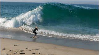 Expert Skimboarders Try to Catch Waves