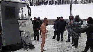 Ukraine police brutality Naked demonstrator forced to stand in snow at -10C