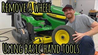 How to remove a wheel from a John Deere lawn tractor using basic tools