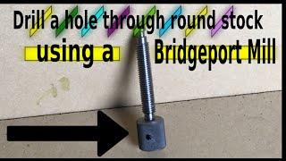 Drilling a hole in round stock using a collet block and a Bridgeport mill.