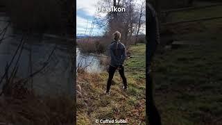 Woman handcuffed and ankle cuffed at a lake   Frau mit Hand- und Fusschellen am Greifensee