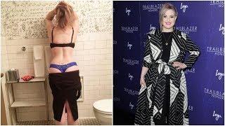 Kelly Osbourne flashes her bum after getting stuck in a new dress