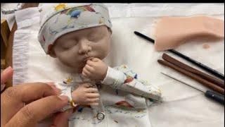 Sculpting a baby face in polymer clay time lapse video