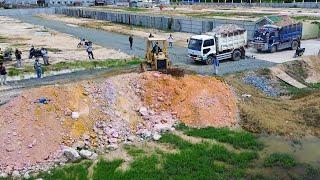 Professional landfill operator with Dozer Komatsu D58E filling land quickly