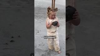 Little girl finds treasure on beach vacation ️