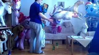 Inflating Mylar  Unicorn balloon