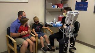 Kids 5 and up get shots in vaccine trial