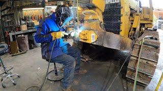 Replacing the mounts on a bulldozer blade