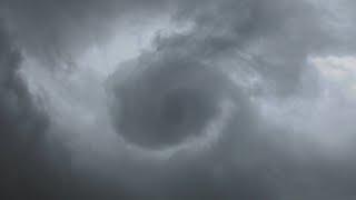 Looking straight up at a funnel cloud