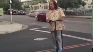 Porn Star Ron Jeremy falls off a scooter.