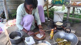 village girl makes roti and alu eating traditional style in firewood