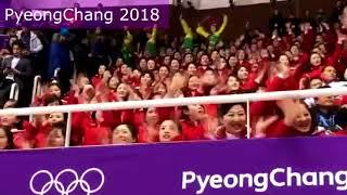 Annoying womens supporters from North Korea are singing and clapping extremly loud