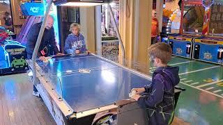 Harry Sam and Max playing air hockey pier 39 Sam Francisco Oct 15 2022