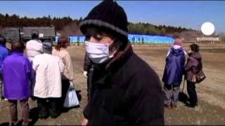 Temporary mass graves for Japan tsunami victims