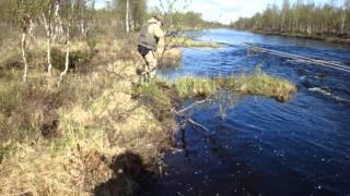 Lining a canoe in the Repojoki river North Finland