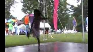 Young Asian girl dancing at local music festival