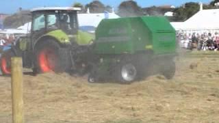 Claas Arion 640 with a McHale F550 Round Baler