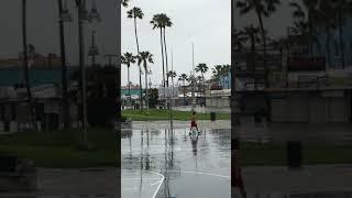 Man on empty Venice Boardwalk basketball courts 32220