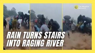 Tourists Hang On as Stairs Become Raging River at Historic Sight in India