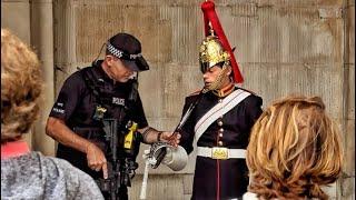 UPDATE HORSE GUARDS CLOSES DOWN - ARMED OFFICER HELPS TROOPER