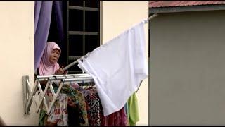 Malaysians hoist white flags for help in lockdown