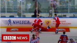 Russias President Putin falls on ice after hockey match - BBC News