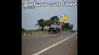black Toyota Fortuner public Road flying