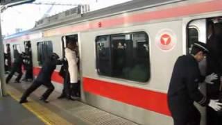 People stuffed onto a train in Tokyo Japan train stuffing Tokyo