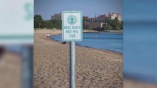 Someone installed a nude beach sign at Chicago beach