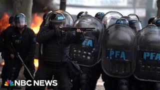 Argentine riot police fire water cannons and tear gas to disperse protesters outside Congress